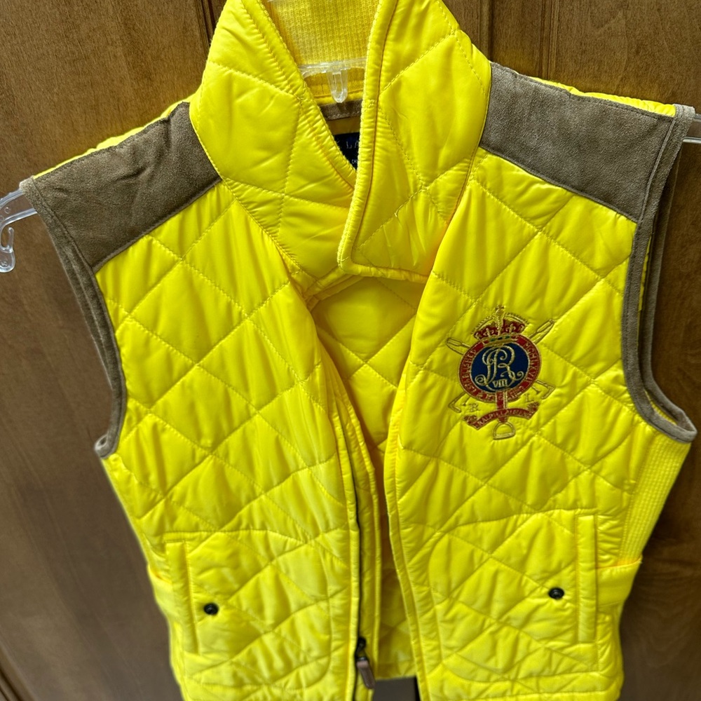 Yellow vest with imitation suede around top of shoulders and arm holes